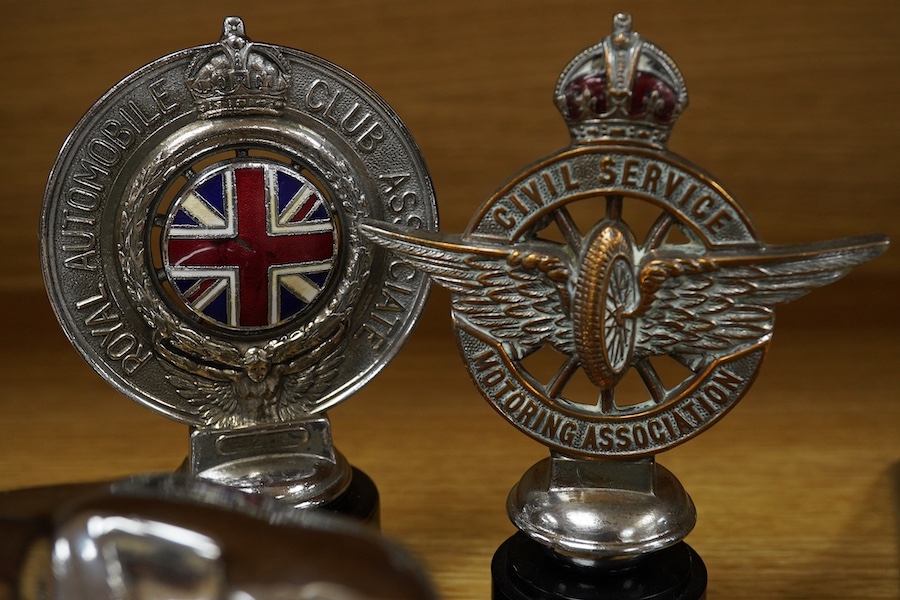 Three Jaguar car mascots in the form of the leaping Jaguar, together with an early Jaguar bonnet decoration, a ‘Royal Automobile Club Associate’ radiator cap mascot with enamel Union flag to the centre, and a ‘Civil Serv